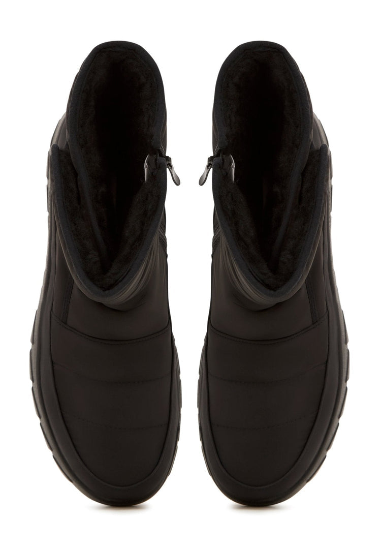 A pair of stylish platform winter boots for women, perfect for cold weather with their warm and cozy design.