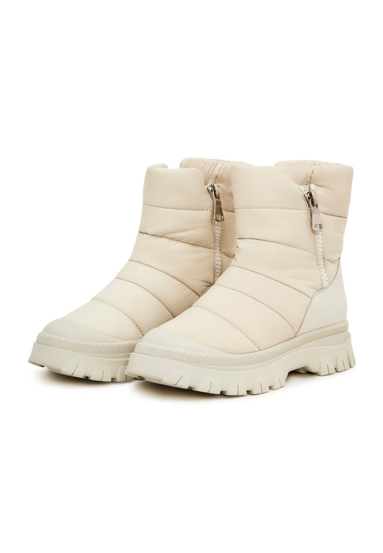 A trendy pair of beige platform winter boots, a must-have for women's fashion this season
