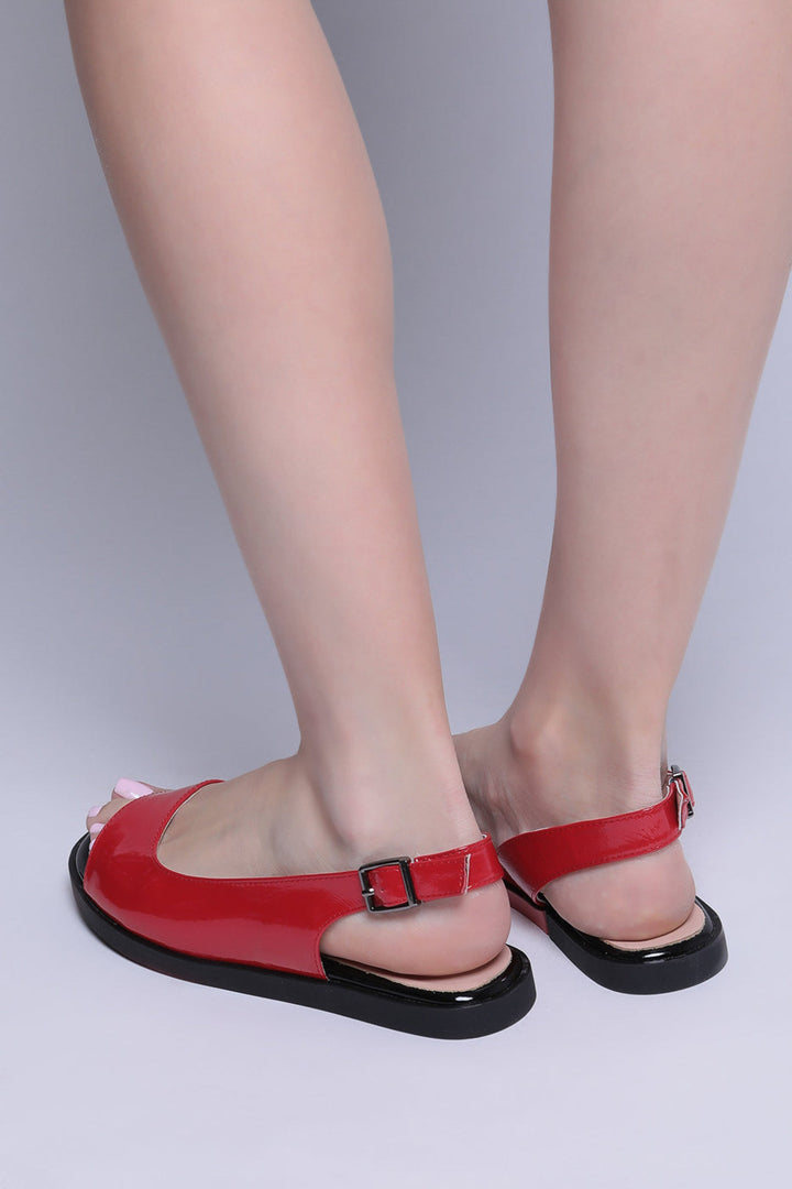 A pair of stylish slingback flats in a glossy finish, perfect for women's footwear fashion.