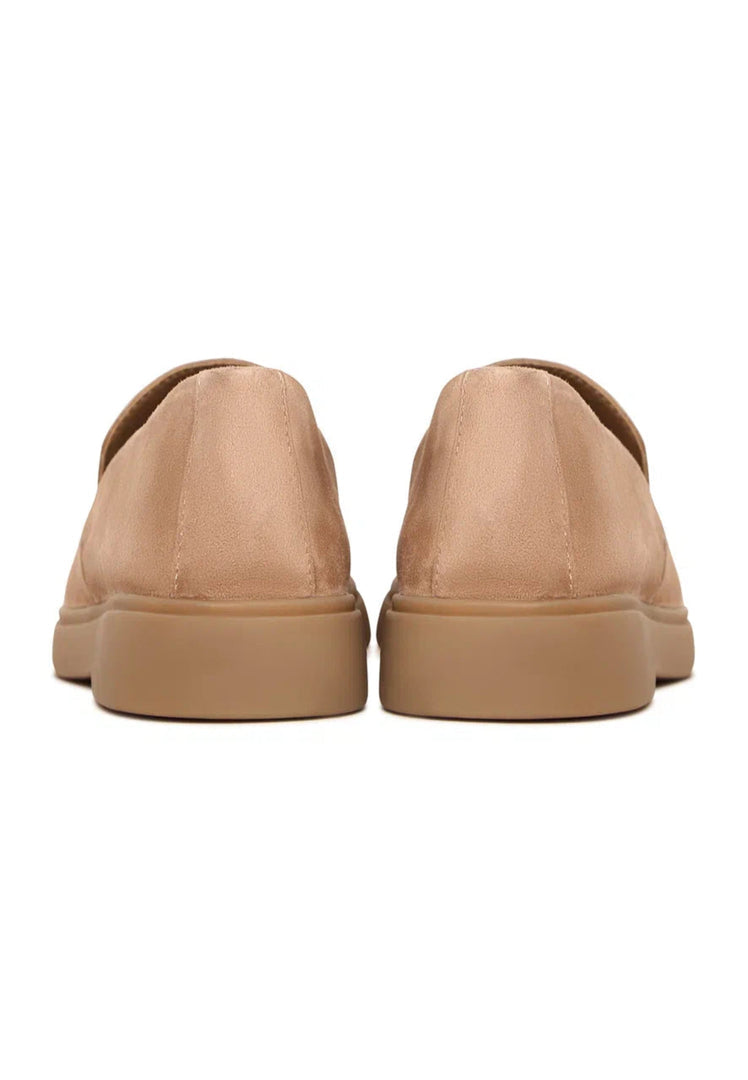A pair of beige loafers, perfect for urban style comfort. Stay trendy in these fashionable slip-ons.