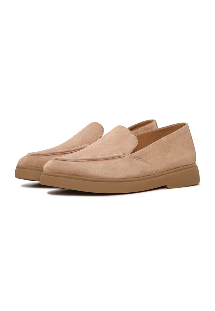 A pair of beige loafers, perfect for urban style and ultimate comfort, these trendy and fashionable slip-ons are a must-have in your footwear collection.