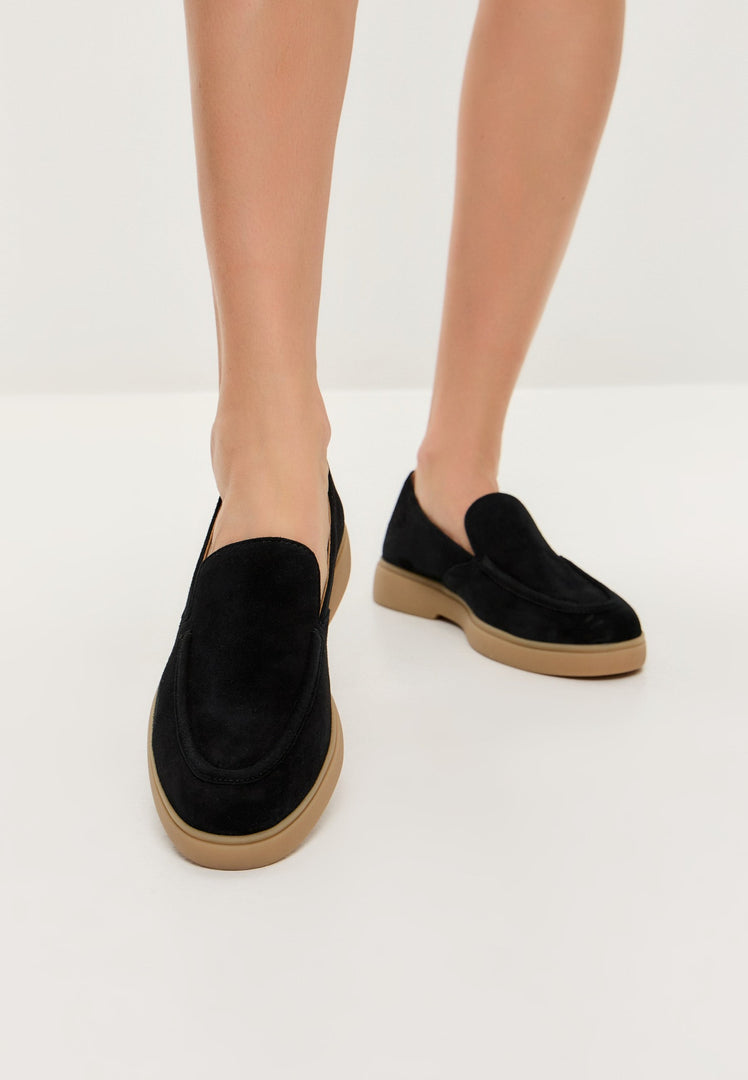 A stylish pair of urban ease black loafers, perfect for men looking for comfortable and trendy footwear.
