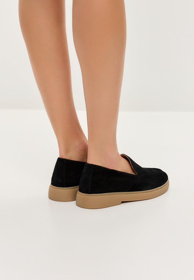 A stylish pair of black urban ease loafers, perfect for the modern man looking for comfortable and trendy footwear.