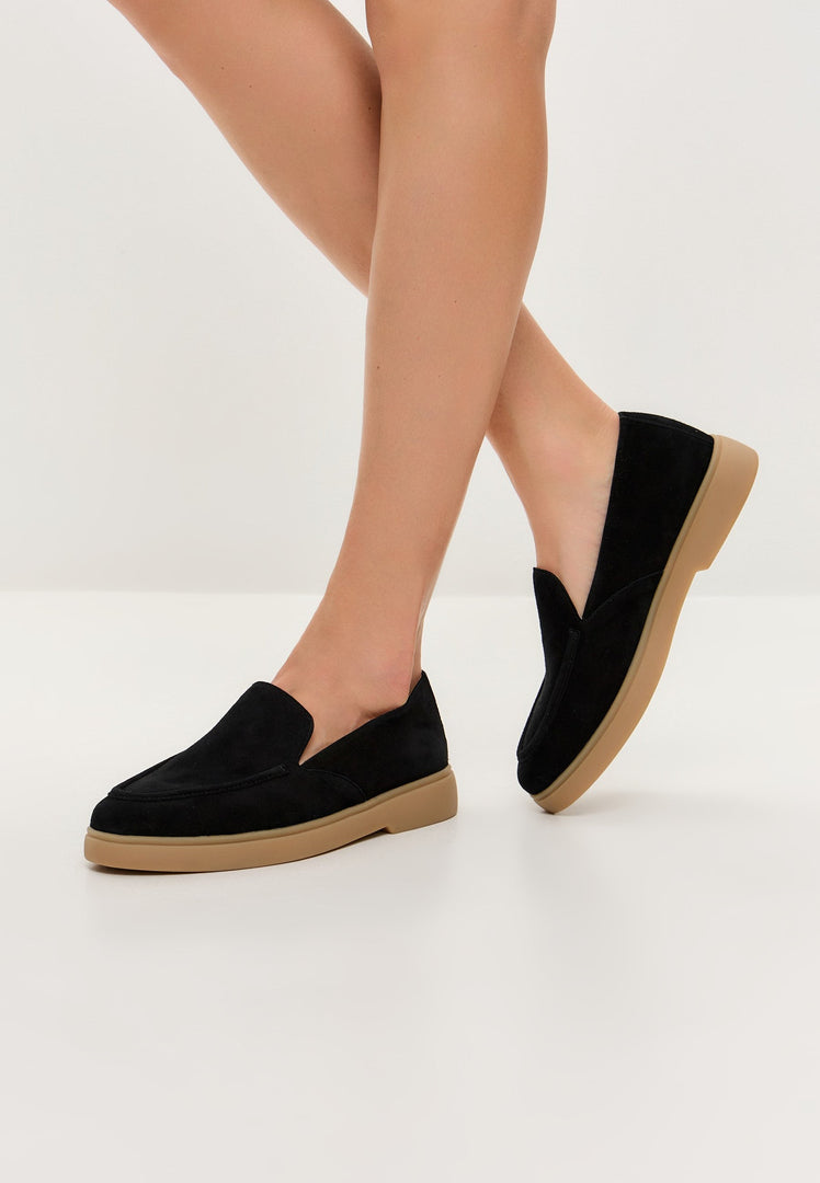 A stylish pair of black Urban Ease loafers for men, perfect for a comfortable and fashionable look.