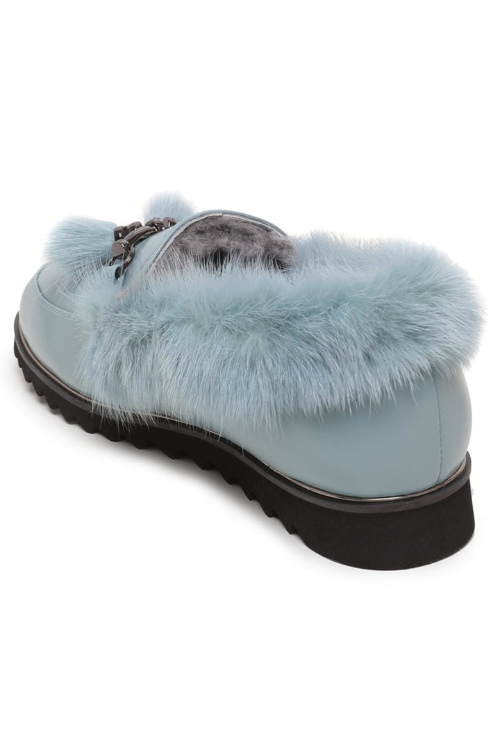 A pair of stylish women's fur loafers, perfect for cold weather, with a frost charm design.