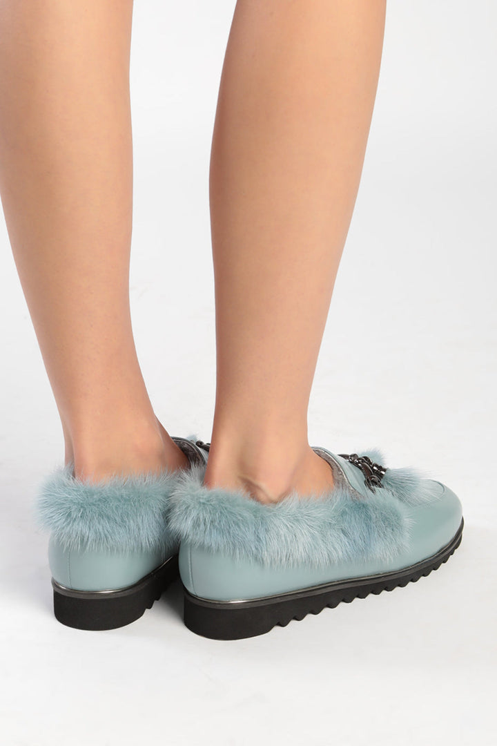 A pair of stylish Frost Charm Fur Loafers for women, perfect for cold weather and winter fashion.