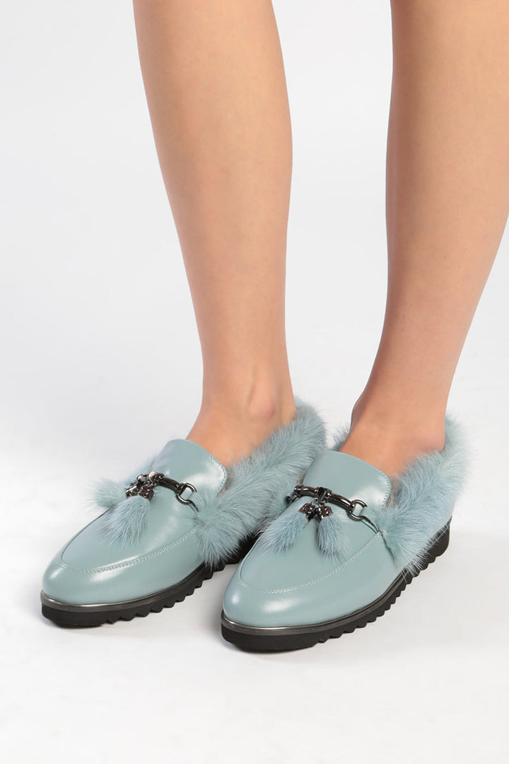 A cozy pair of Frost Charm Fur Loafers for women, perfect for the winter season. Stay stylish and warm in these cold weather fur shoes.