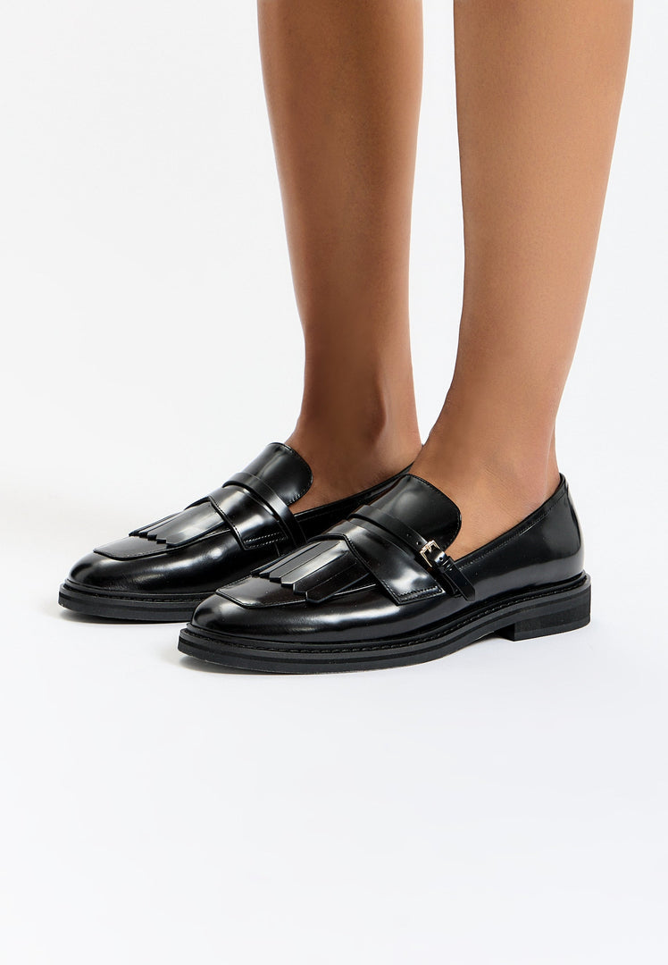 Step out in style with these classic fringe loafers, the epitome of timeless and traditional vintage footwear.