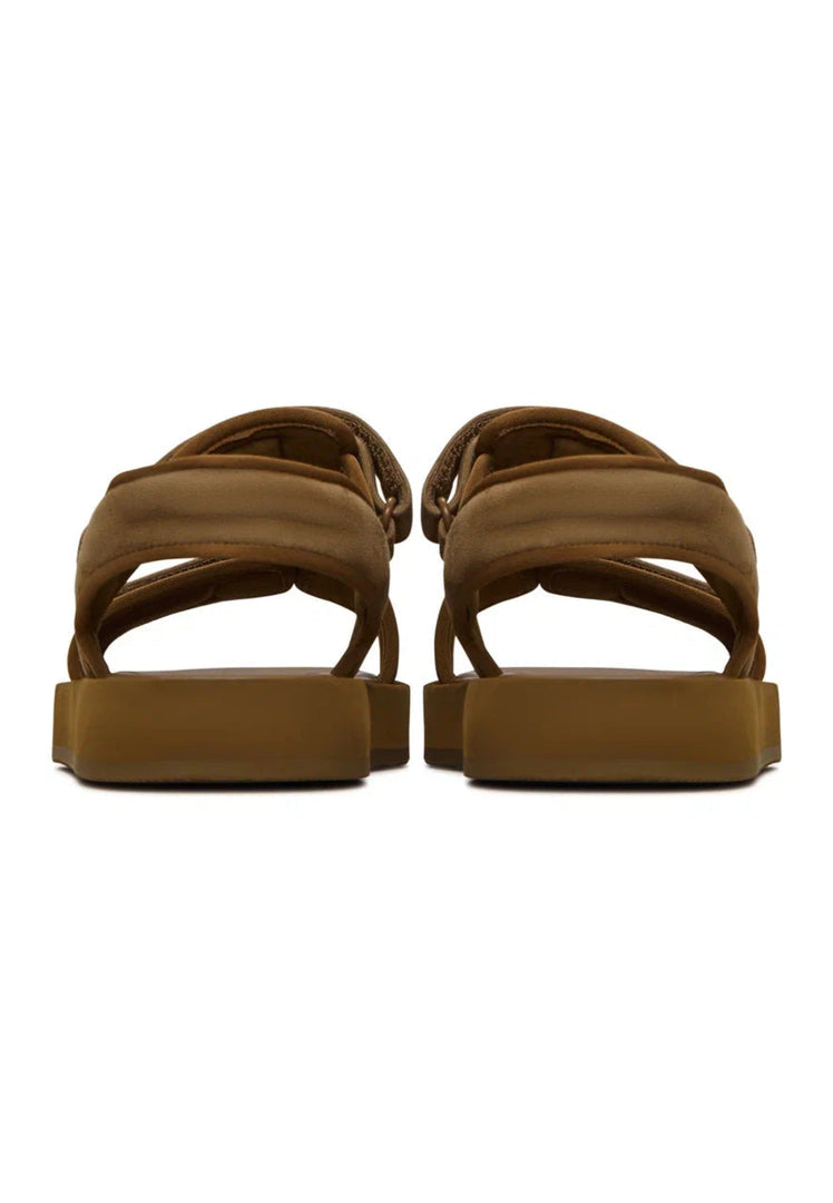 A pair of casual comfort brown suede sandals with velcro fastening for women.