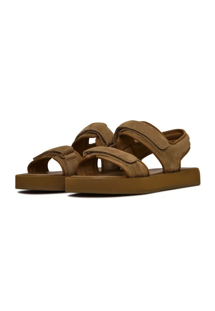 A pair of casual brown suede women's sandals with velcro fastening for ultimate comfort.