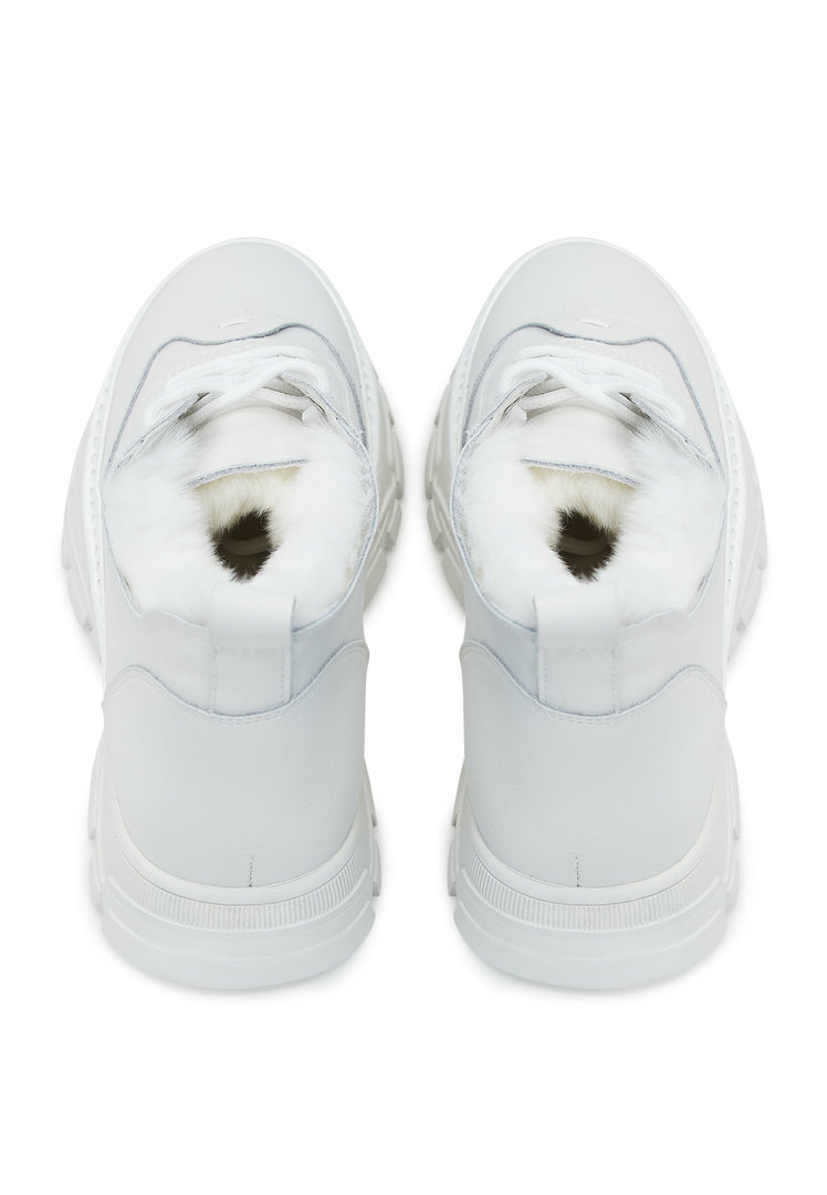A pair of chunky white sneakers with a cozy merino wool lining, perfect for staying warm and stylish during chilly days.