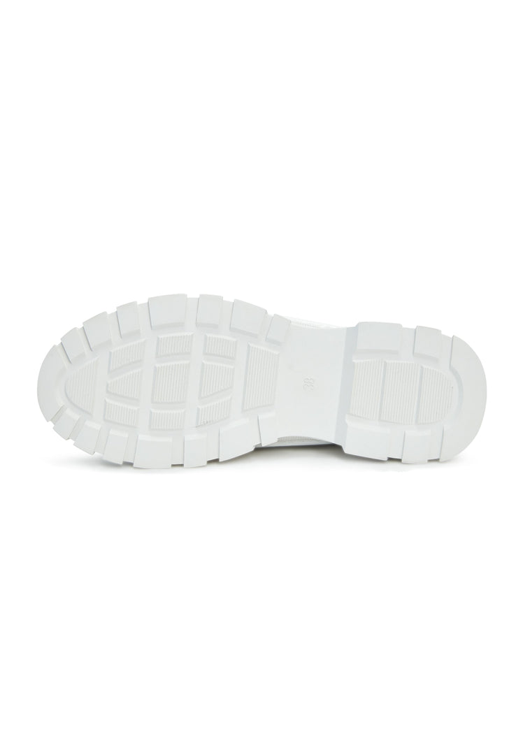 A modern pair of chunky white sneakers with a cozy merino wool lining, perfect for those looking for a stylish and comfortable footwear option.