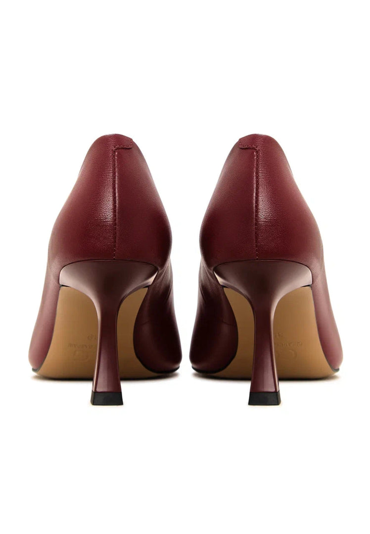 A pair of elegant Bordeaux leather pumps, classic designer heels perfect for any occasion.
