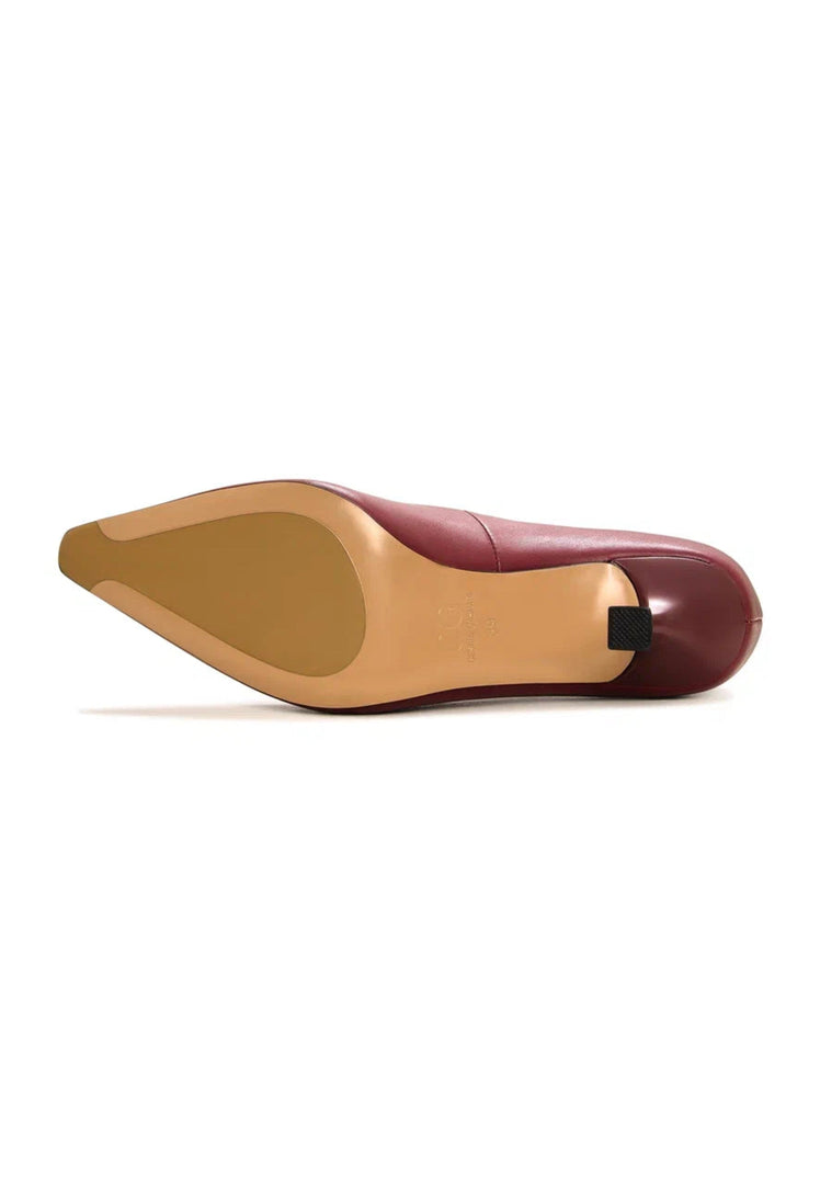 A pair of stylish Bordeaux leather pumps, classic designer heels for a chic look.