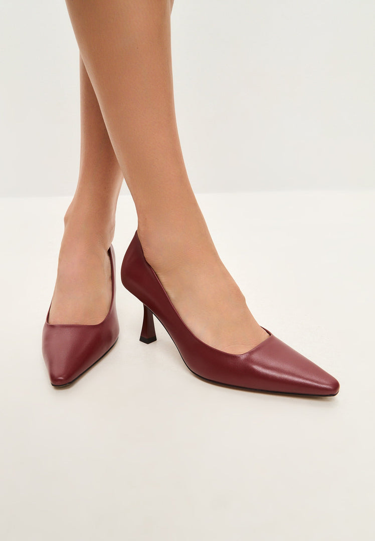 A pair of elegant designer Bordeaux leather pumps - classic, stylish leather heels for a sophisticated look.