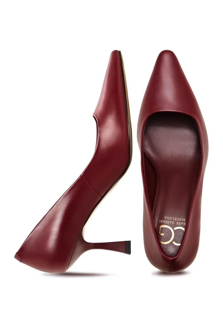 A pair of elegant designer Bordeaux leather pumps, classic heels for a sophisticated look.