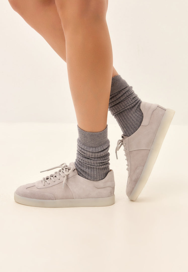 Stylish gray suede low-top sneakers - a classic pair of suede shoes, perfect for any casual outfit.