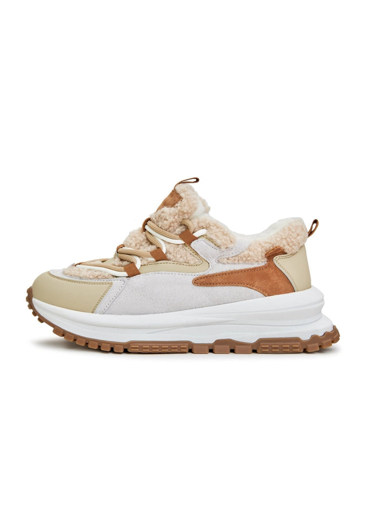 A pair of stylish beige platform sneakers for women, the perfect trendy and fashionable elevated footwear option.