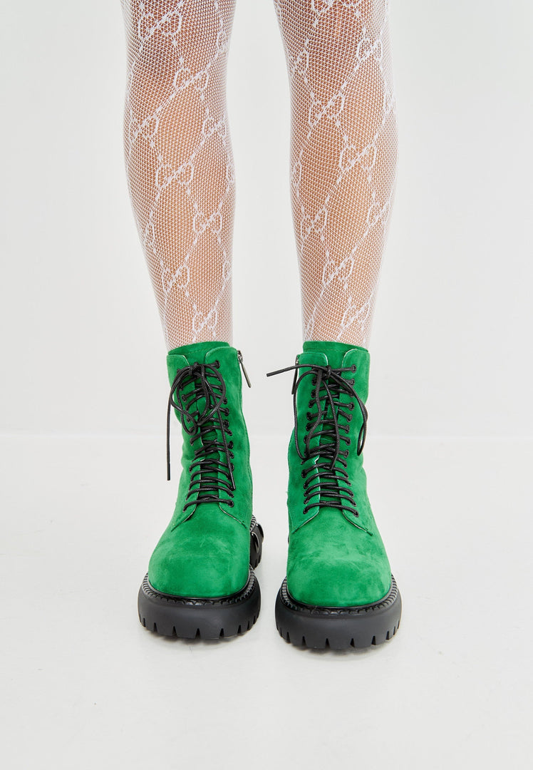 A trendy pair of lace-up combat boots with a chunky sole in green, perfect for those seeking military-style women's fashion footwear.