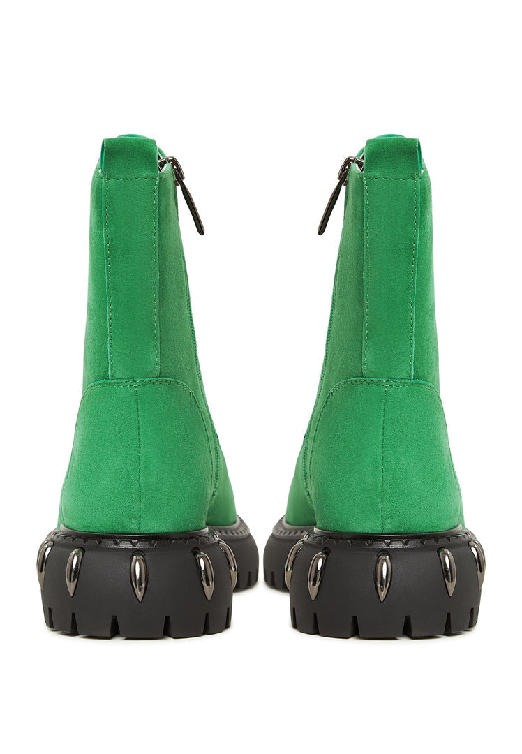 A stylish pair of green lace-up combat boots with chunky soles, perfect for women's military style fashion footwear.