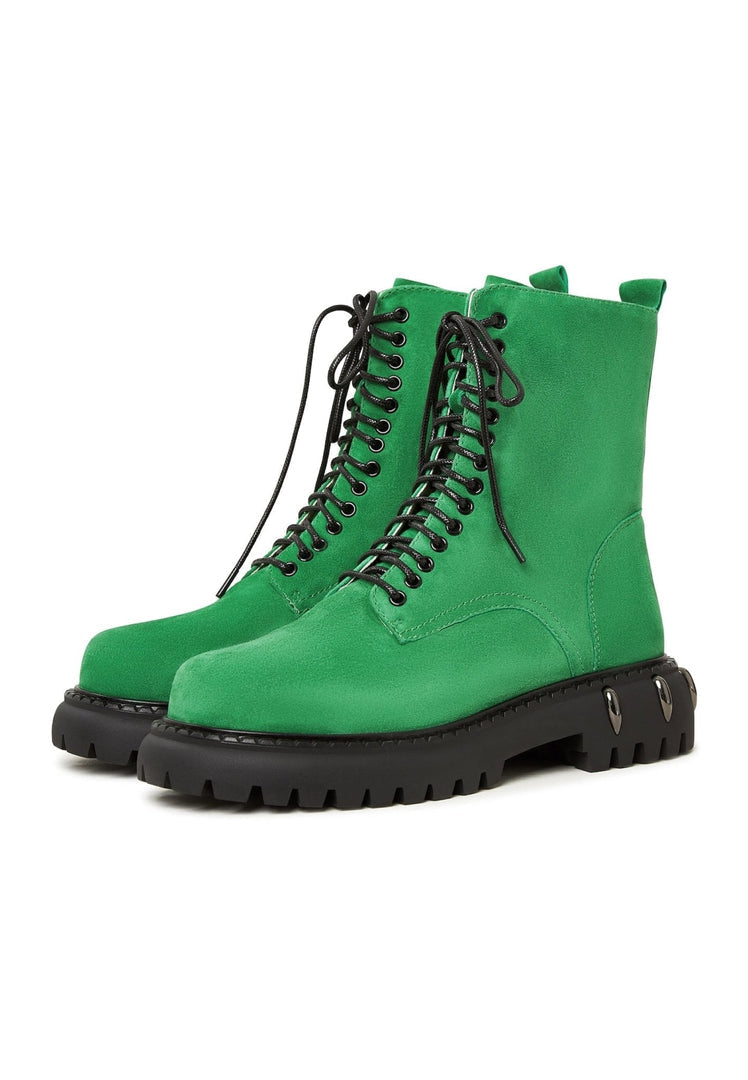 A trendy pair of lace-up combat boots with a chunky sole in fashionable green, perfect for military style enthusiasts and women's fashion footwear.