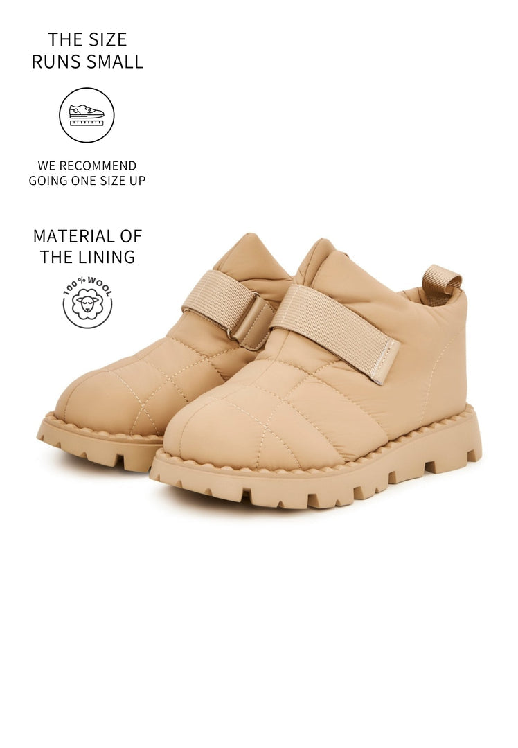 Stay warm and stylish in these beige suede winter boots with cozy wool lining, the perfect cold weather footwear.