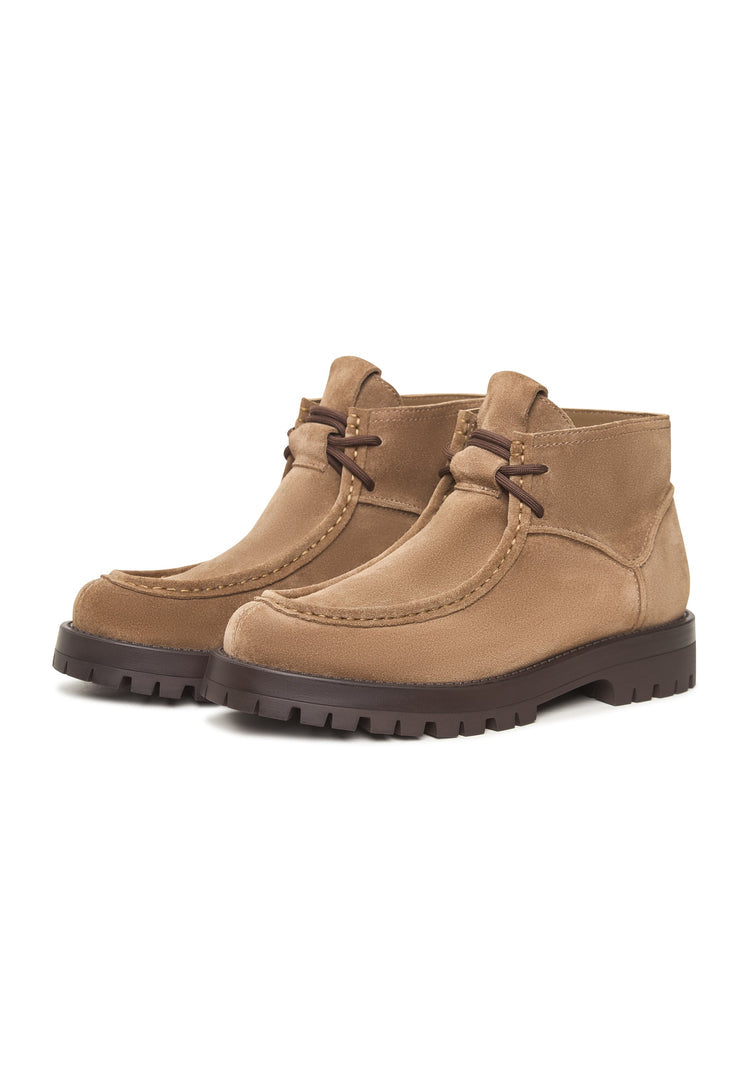 A pair of stylish beige suede lace-up ankle boots by Mavi.