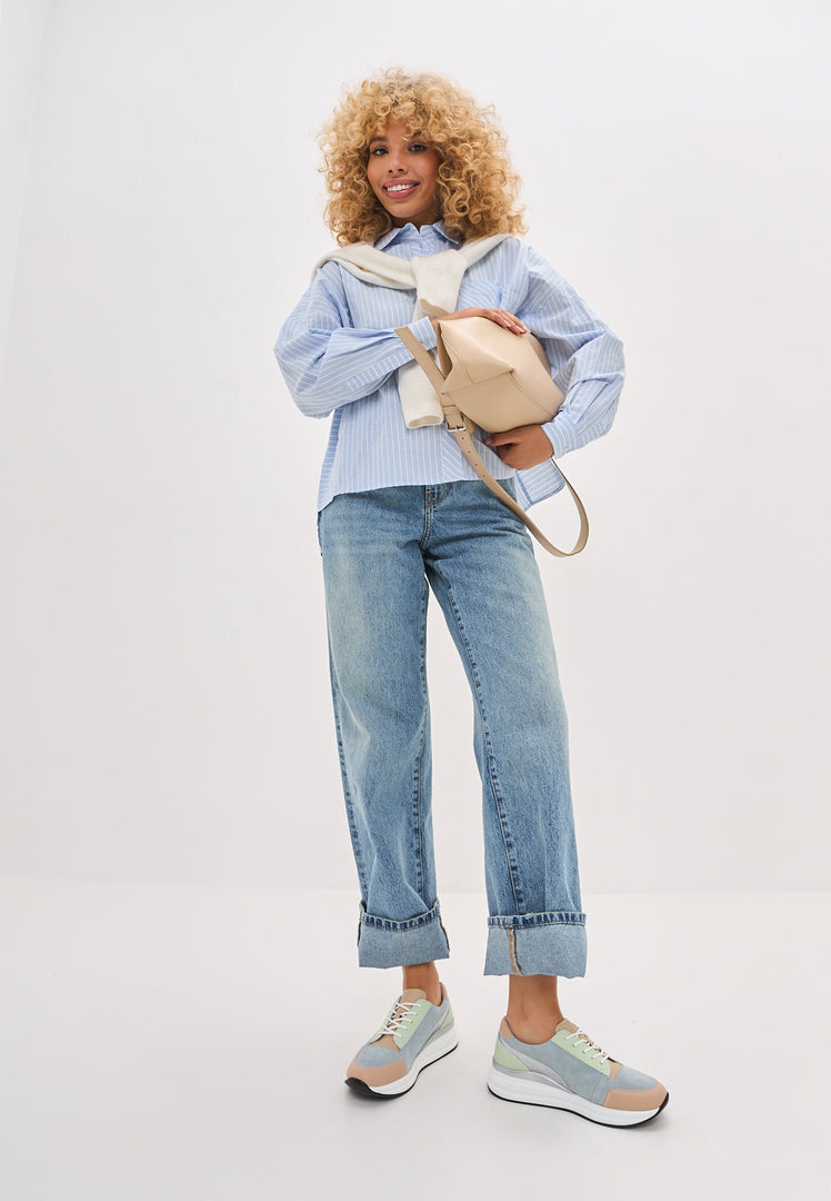 A pair of stylish blue leather sneakers with Eva soles, perfect for both casual wear and athletic activities.