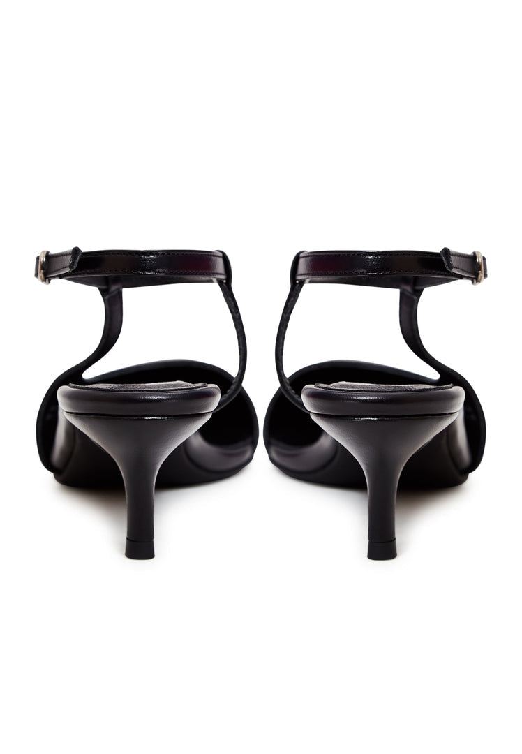 A pair of elegant luxe black pumps, representing luxury footwear with designer heels, classic black shoes.