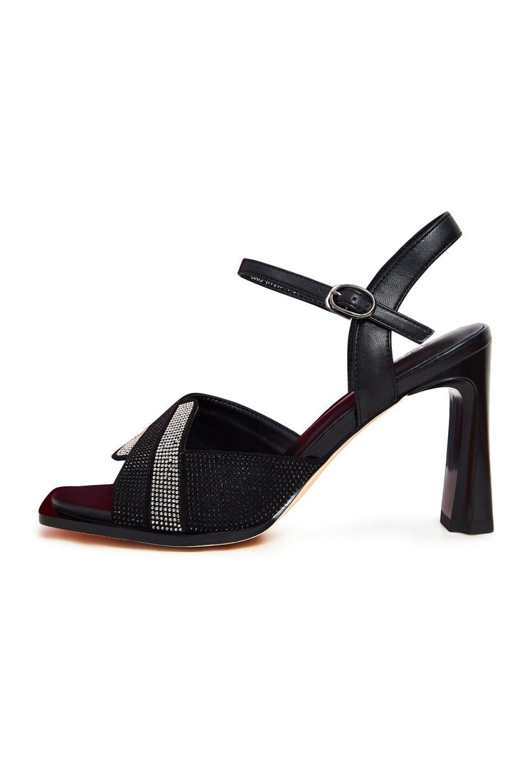 A pair of stylish and upscale black sandals with an elegant design, perfect for any formal occasion.