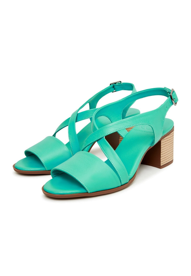 A pair of stylish green block heel sandals, perfect for a casual and trendy look.