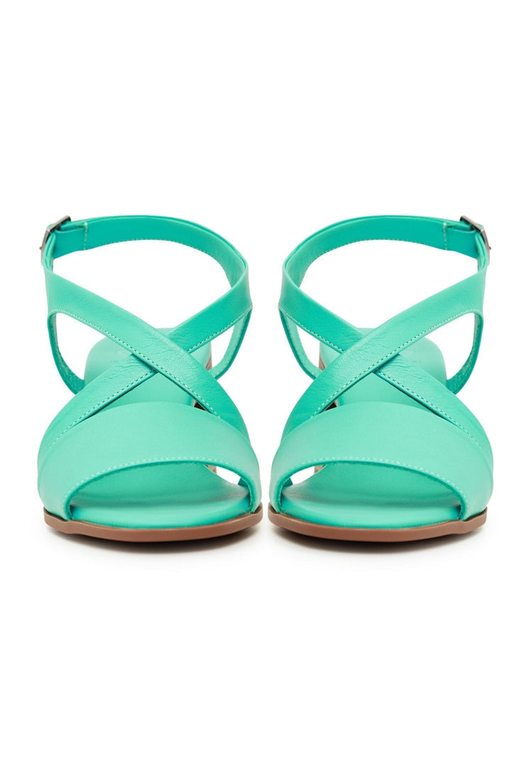 A stylish pair of casual green block heel sandals, perfect for any occasion.