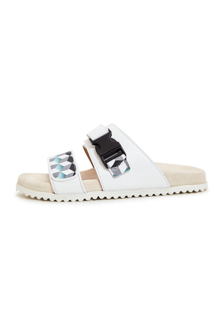 A pair of white Meredith mules, flat sole women's footwear perfect for summer days.
