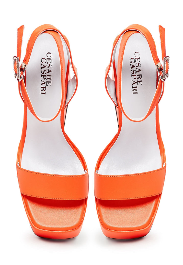 A stylish pair of sophisticated orange high heel sandals, the perfect elegant footwear for women's fashion.