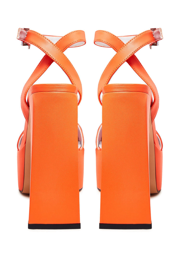 A pair of sophisticated orange high heel sandals, ideal for women's fashion, showcasing elegant footwear.
