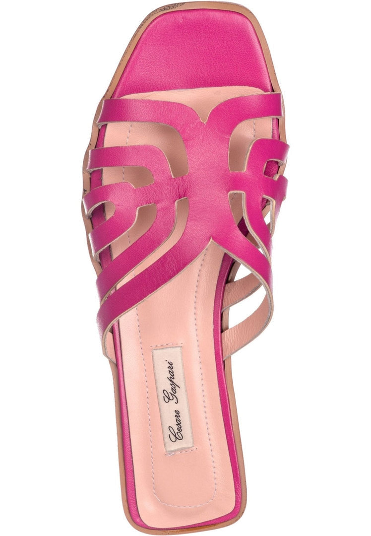 Stylish pink women's laser cut sandals, perfect for a chic and trendy look.