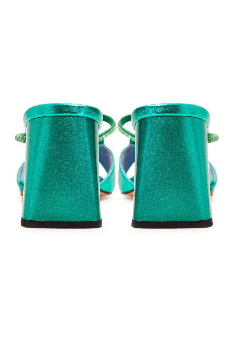 A stylish pair of backless green heels, also known as Rosalia heels, a chic and trendy choice for any outfit.
