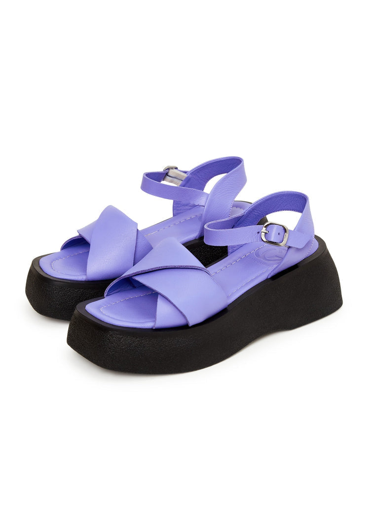 A fashionable pair of women's lilac leather platform sandals with high heels, perfect for summer vibes.