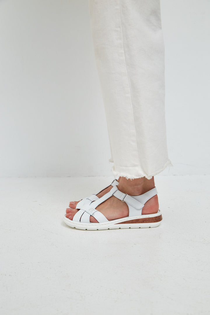 A stylish pair of leather platform heels for women, featuring urban sandals with high heels and a trendy platform design.