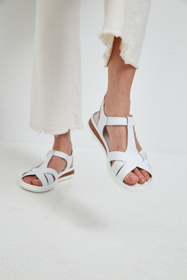 A stylish pair of leather platform heels with an urban flair for women, featuring high heels and a platform design.