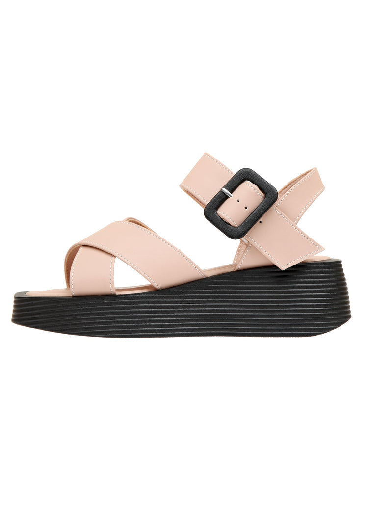 Blush pink strappy sandals for women with a high heel and platform design.