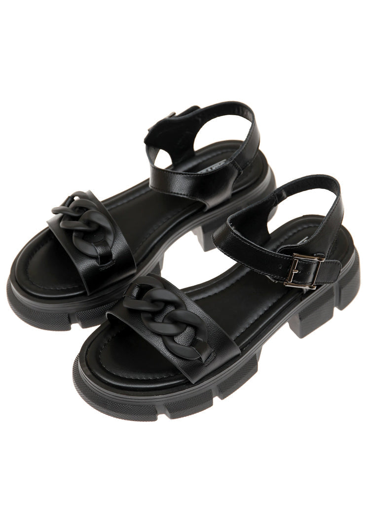 A trendy pair of black chunky leather platform sandals, perfect for summer footwear.