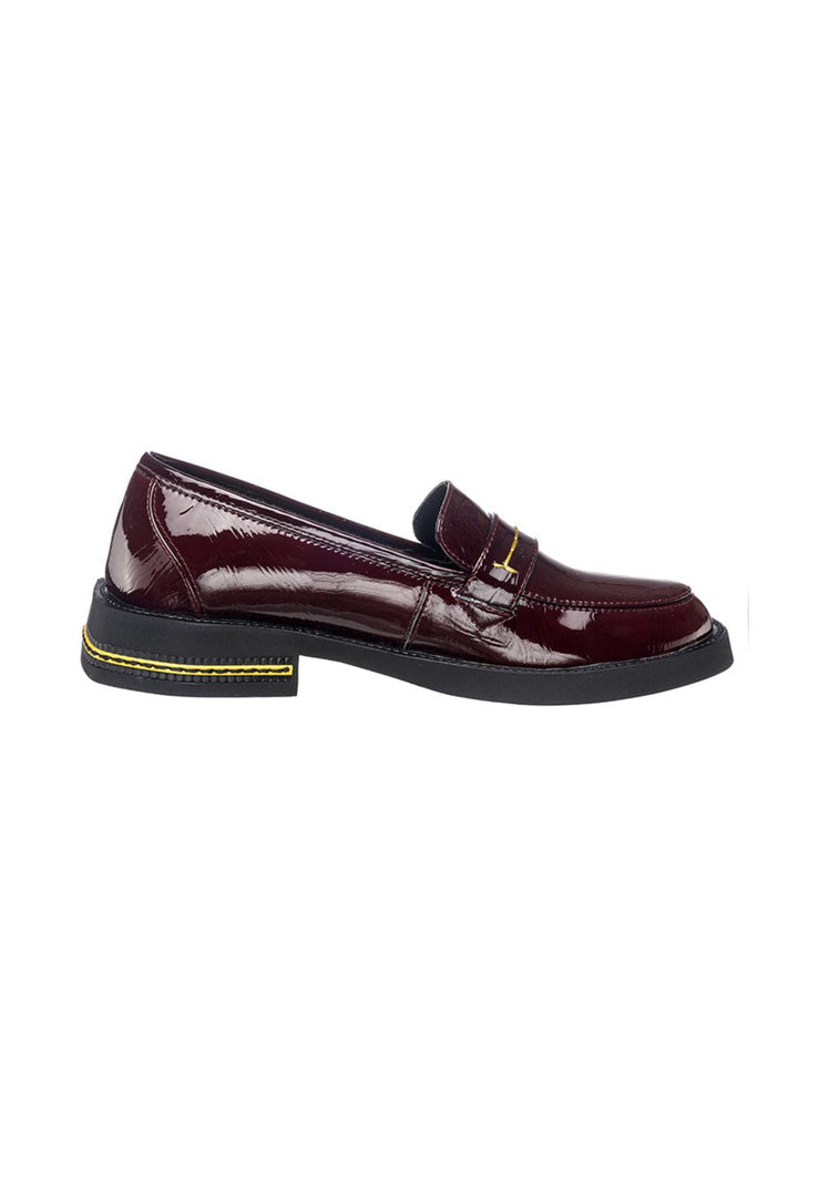 A close-up image of sleek, stylish burgundy patent leather loafers, designed for a comfortable fit.