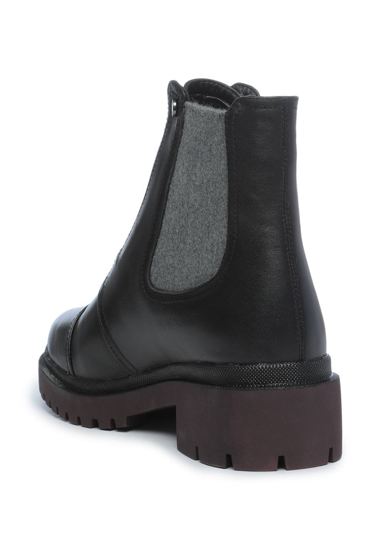 A collection of high-quality leather ankle boots, including stylish designer shoes.