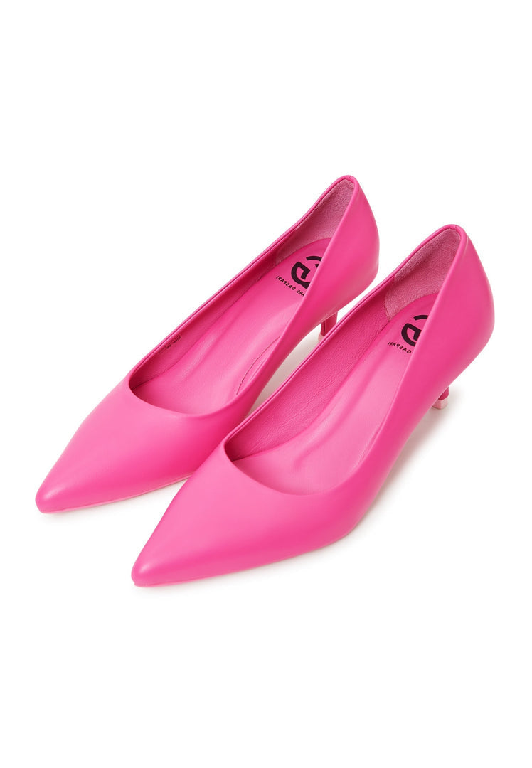 A pair of luxurious fuchsia pumps designed for women, showcasing elegant high-end footwear.