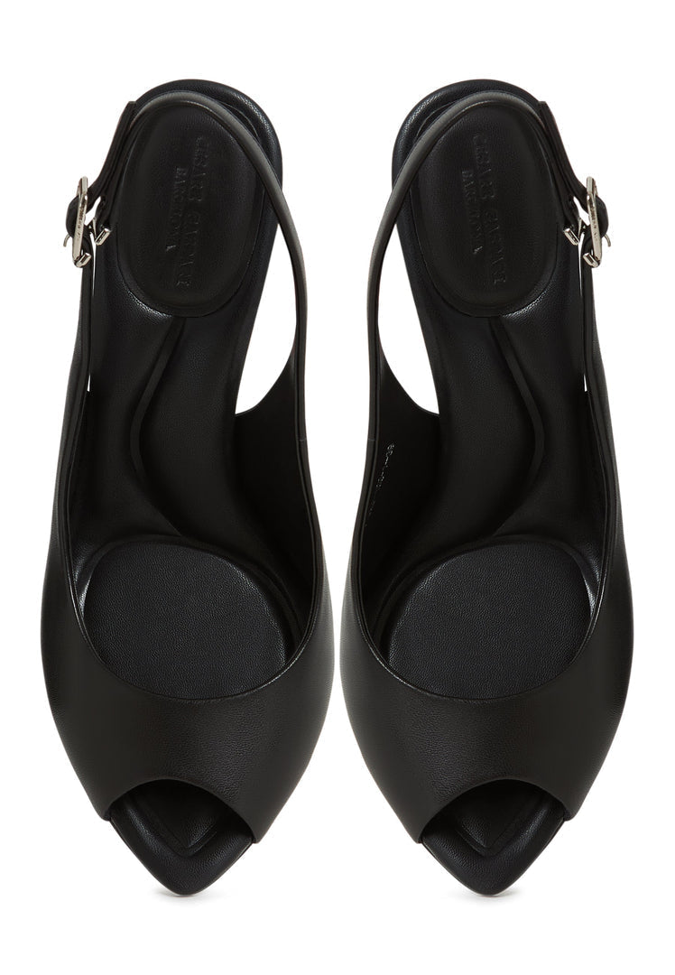 A pair of black stiletto heels high heeled Mariana sandals, stylish women's footwear.