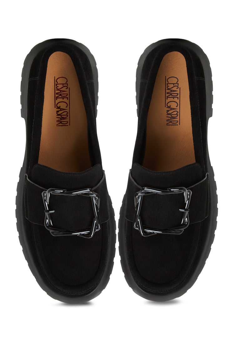 A pair of sleek black platform loafers for women, reminiscent of vintage style with a modern twist, featuring the trendy Jenny design.