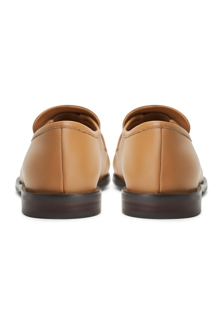 A stylish pair of beige leather loafers named Isabel, perfect for women looking for classic footwear.