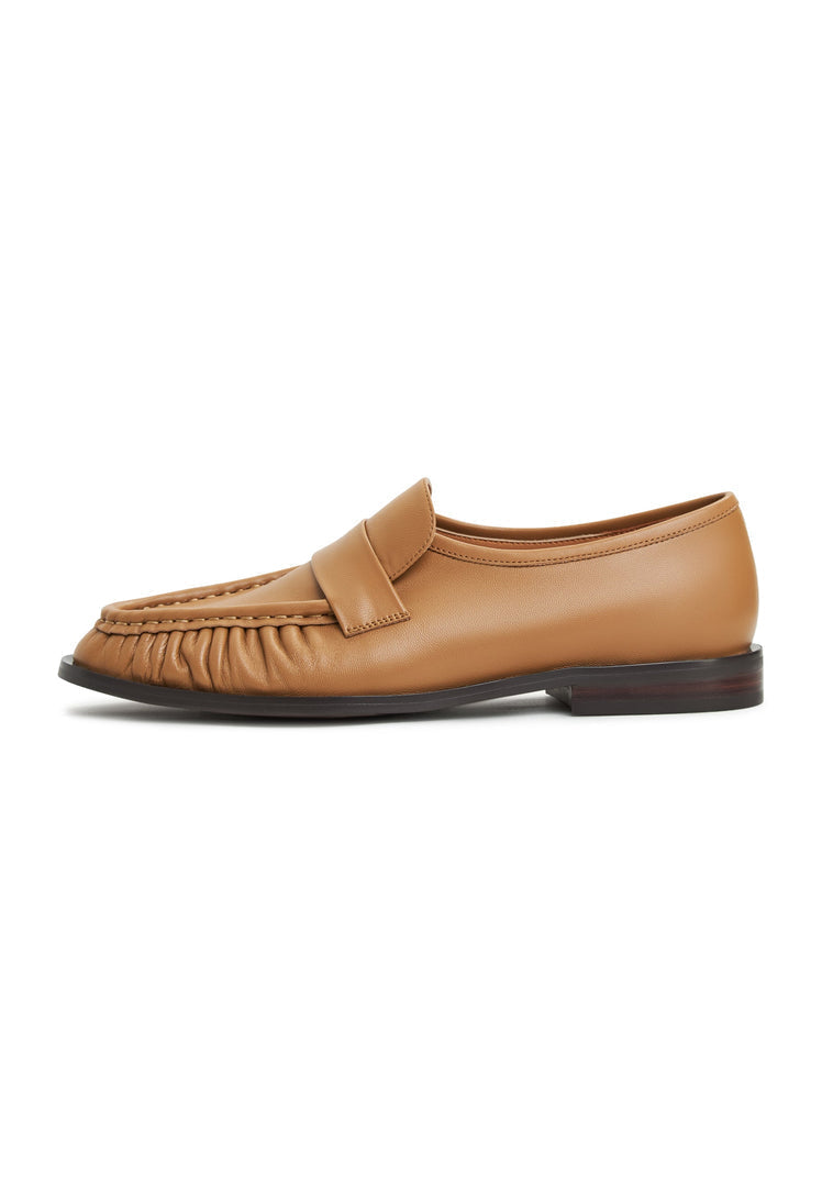 A stylish pair of Isabel beige leather loafers for women - classic footwear.
