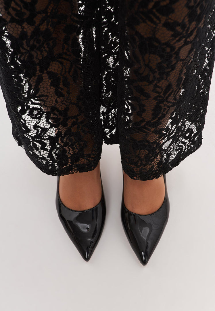 A pair of elegant black stiletto pumps, perfect high heeled shoes for women's glamorous outfits.